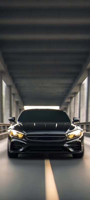 Black Sports Car Under Bridge Image